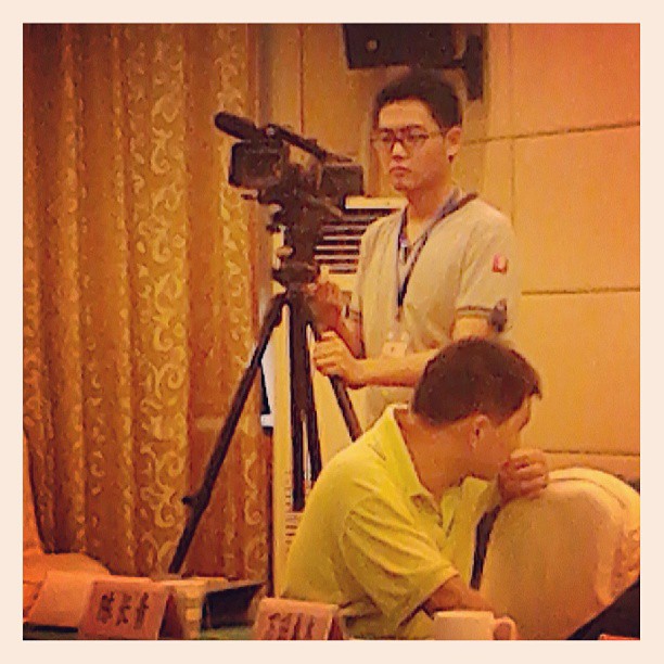 2013/08/11 — 会场的摄影师。（喜林摄，国贸南航明珠商务酒店。）